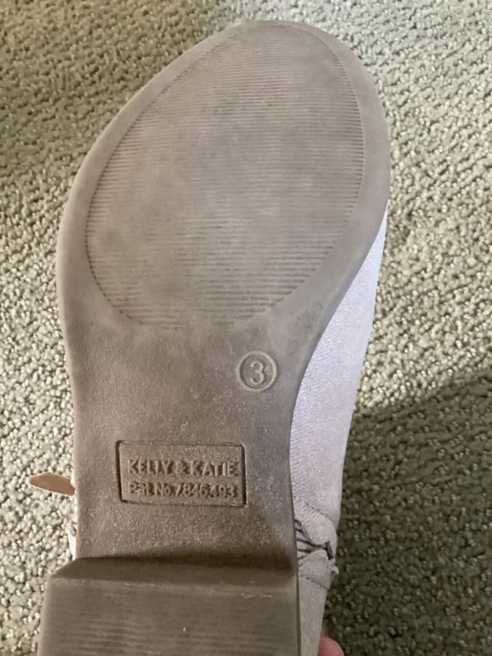 Heels for kids with bow on back of shoe.